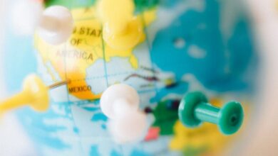 Tour Planning - A vibrant globe with colorful pins marking destinations, symbolizing travel plans.
