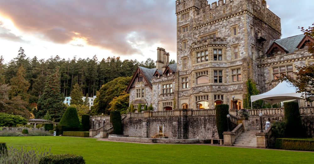 Educational Tours - Historic Hatley Castle in Victoria, BC, at sunset, showcasing its stunning architecture and lush gardens.