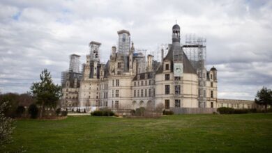 History Tours - Château de Chambord in France, with picturesque clouds and green lawns.