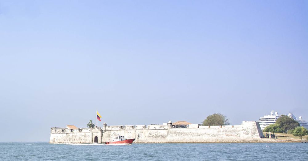 Photography Tours - Beautiful sea view of a historic fortress on the Cartagena coastline under clear blue skies.