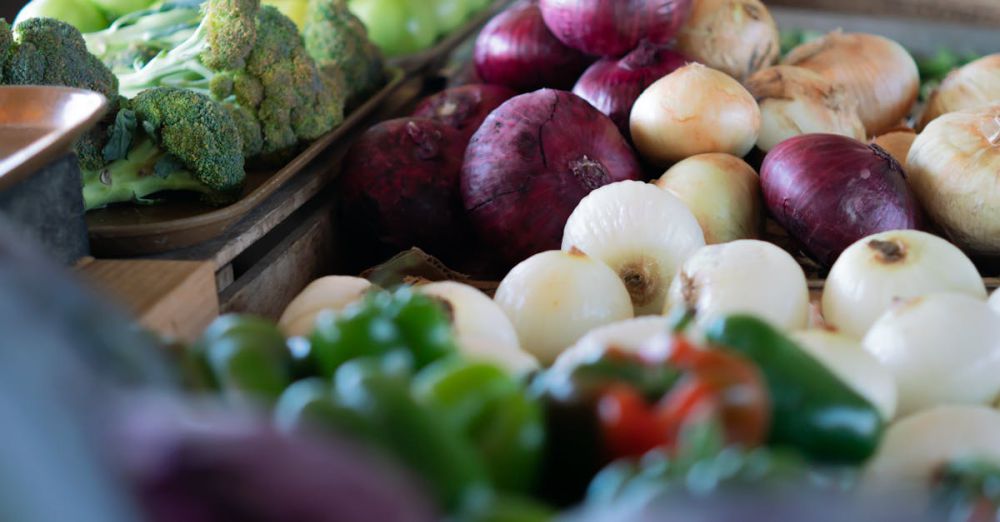 Farmers Markets - A colorful array of fresh vegetables displayed at an outdoor market.