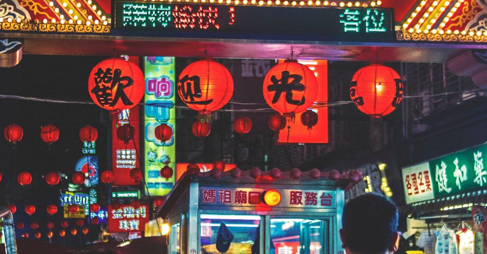 Popular Farmers Markets - Vibrant crowd and neon signs at the lively Raohe Street Night Market, Taipei.