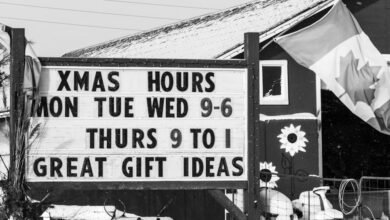 Ontario Farmers Markets - Black and white winter scene at a Canadian countryside Christmas shop with sign and flag.