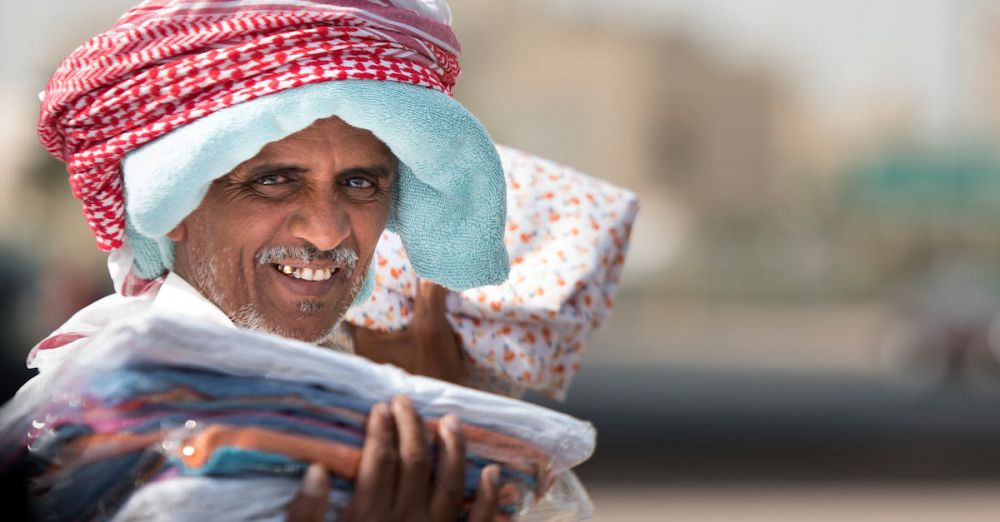 Pet-Friendly Markets - Friendly street vendor in Al Jahra, Kuwait, showcasing traditional wear.