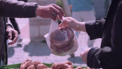 Bread Markets - A street vendor sells fresh pretzels outdoors in Istanbul, capturing a cultural exchange.