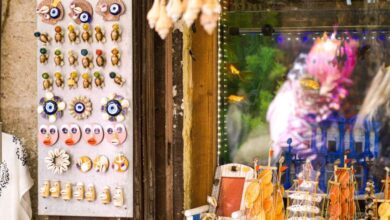 Unique Gifts Markets - Colorful seaside market stall displaying seashell souvenirs and decorative items.