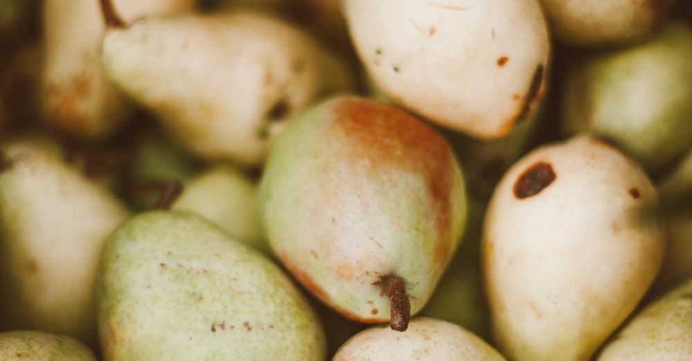 Gluten-Free Markets - Close-up of fresh organic pears showcasing their vibrant colors and textures, ideal for promoting healthy eating.