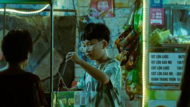 International Farmers Markets - An illuminated street food stall in Vietnam at night, bustling with activity and authentic flavors.