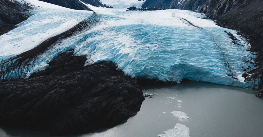 Photography Portaging - Experience the breathtaking beauty of Alaska's Portage Glacier with snowcapped mountains and serene waters.