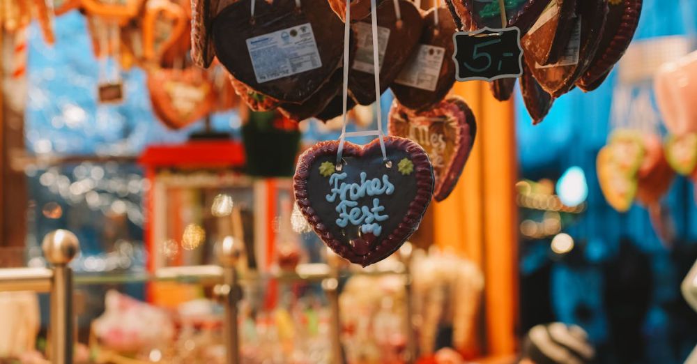 Kids Winter Festivals - A festive Christmas market stall in Düsseldorf with gingerbread hearts and cheerful lights.