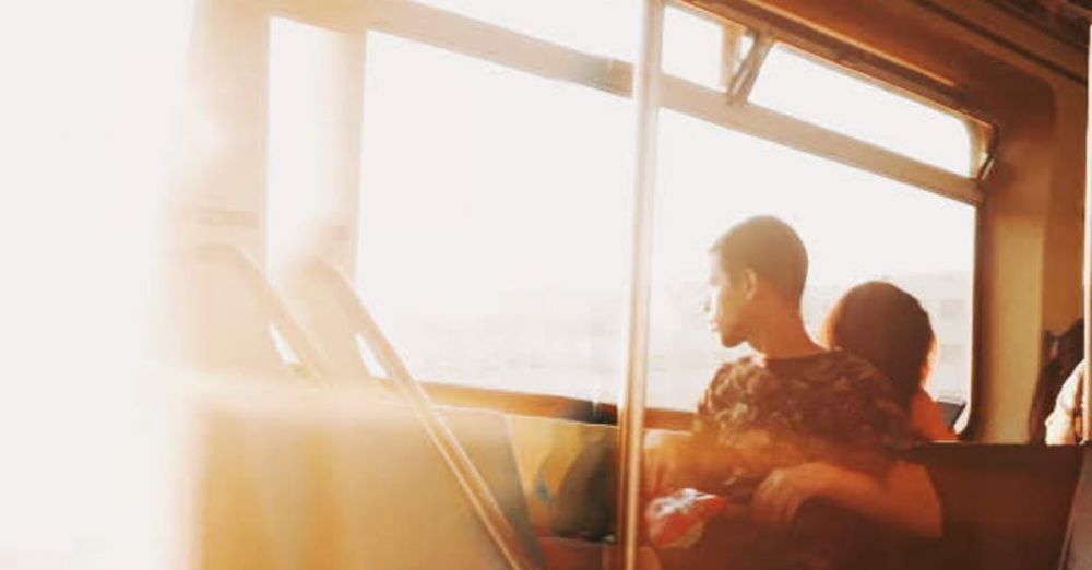 Relaxing Scenic Train Rides - A young couple enjoys a warm sunset view from a train window, creating a serene travel moment.