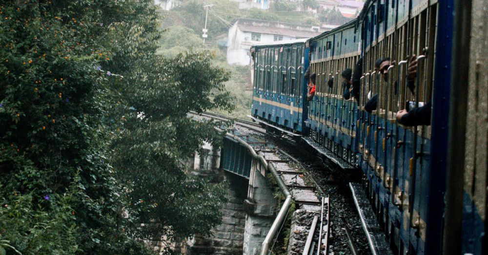 Historical Scenic Train Rides - A picturesque train journey through lush forests near Mysuru, India.