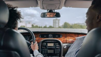 Experiences - Father and son bonding while driving, showcasing guidance and togetherness in a car's interior.