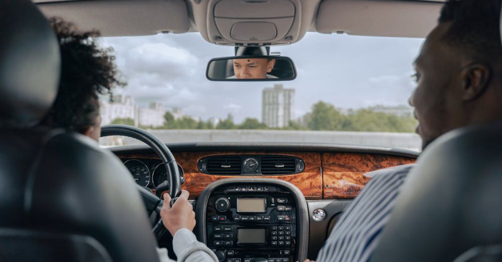 Experiences - Father and son bonding while driving, showcasing guidance and togetherness in a car's interior.