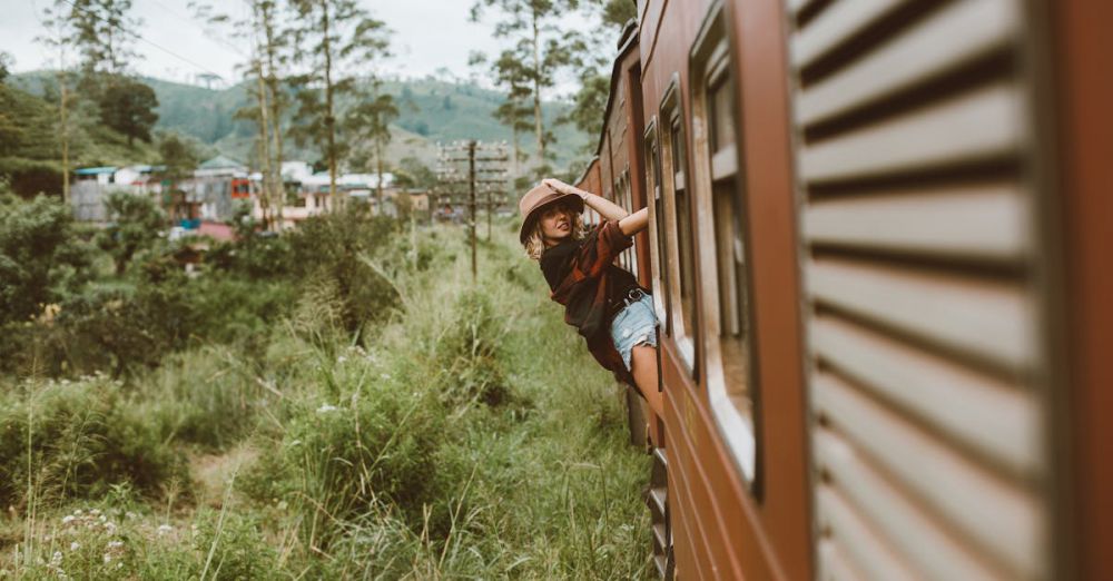 Cross-Country Scenic Train Rides - A young woman in casual attire enjoys a scenic train ride through lush countryside.