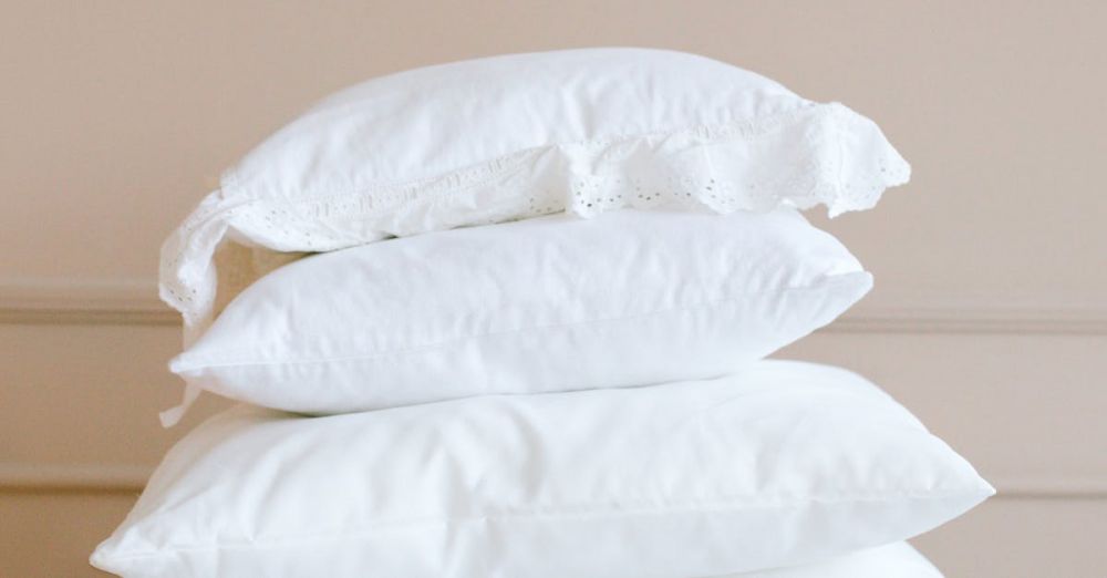 Big Wall Climbing - A stack of white pillows on a neutral background, showcasing elegance and simplicity.