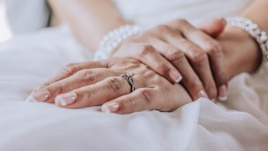 Jewelry - Close-up image of a bride's hands adorned with a wedding ring and jewelry, showcasing elegance.