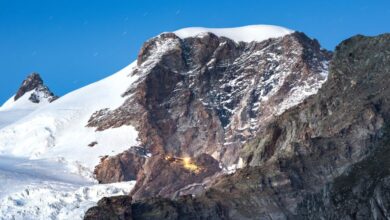 Night Rock Climbing - Breathtaking twilight scene of Monte Rosa with snow-covered peaks and clear night sky.