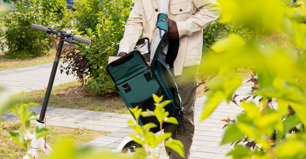 Gardening Urban Gardens - A man stands by an electric scooter in a garden setting near residential buildings, packing a backpack.