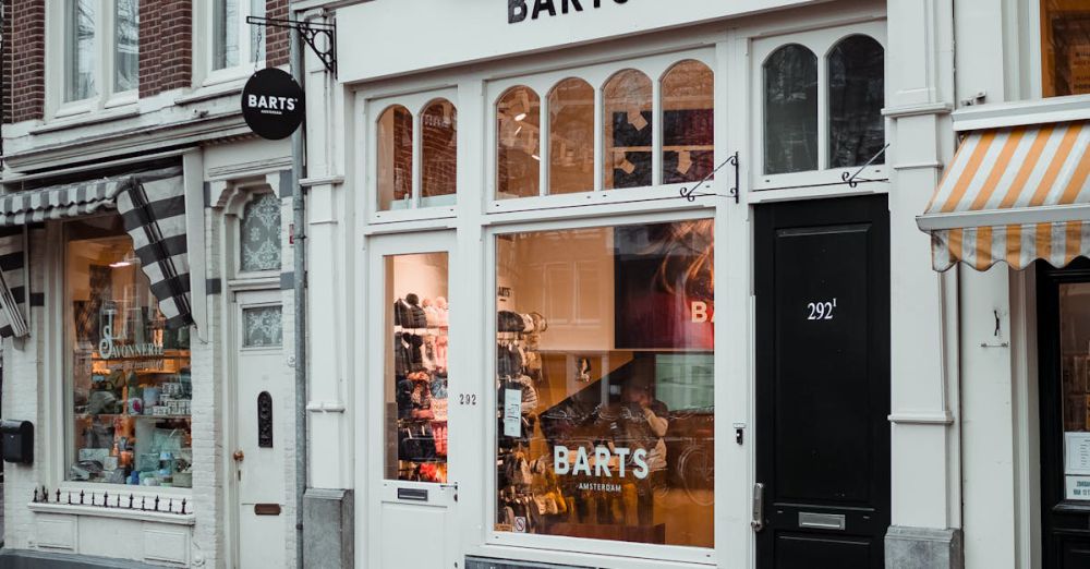 Shops - A cozy urban storefront with unique architecture and welcoming signage captured on a rainy day.