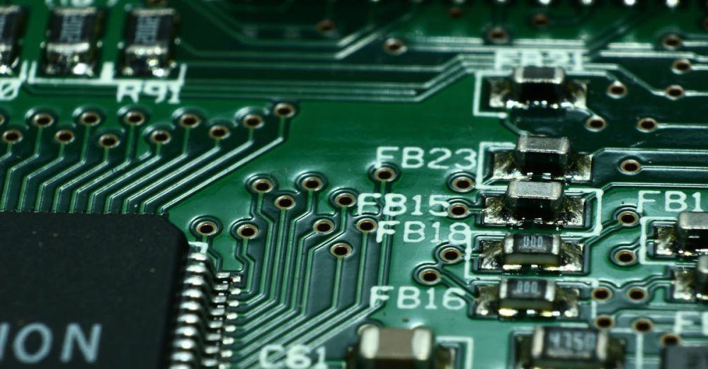 Electronics - Detailed macro view of a circuit board showcasing microchips and electronic components.