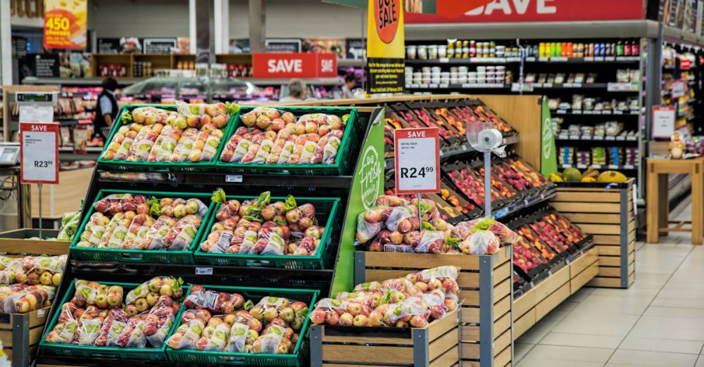 Products - Colorful produce aisle in a supermarket showcasing fresh apples with discount signage.