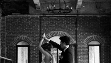 Venues - A couple dances gracefully in a rustic venue, capturing a timeless wedding moment.