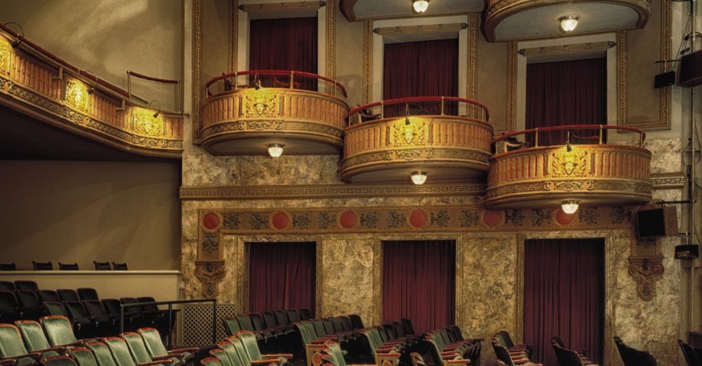 Opera - Classic theater interior featuring ornate balconies and empty seats, perfect for drama or performance themes.