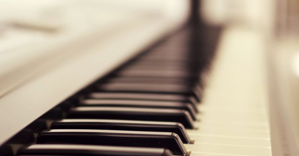 Musical - A classic close-up of piano keys with a soft focus effect, highlighting the black and white keys.