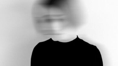 Experimental - Black and white silhouette of a woman with a blurred face, creating an artistic and mysterious effect.