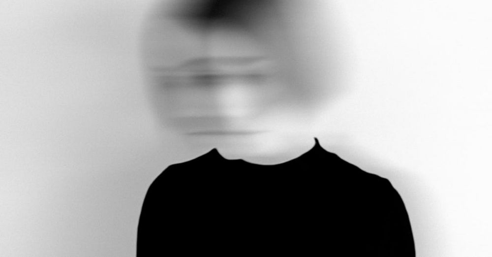 Experimental - Black and white silhouette of a woman with a blurred face, creating an artistic and mysterious effect.