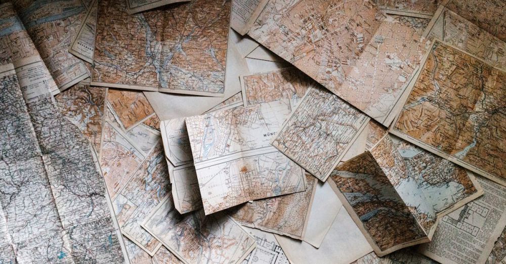 Tours - A collection of vintage maps scattered for exploring world journeys and discoveries.