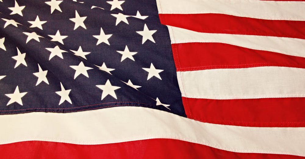 US - Detailed image of the American flag showcasing the stars and stripes symbolizing USA's patriotism and pride.