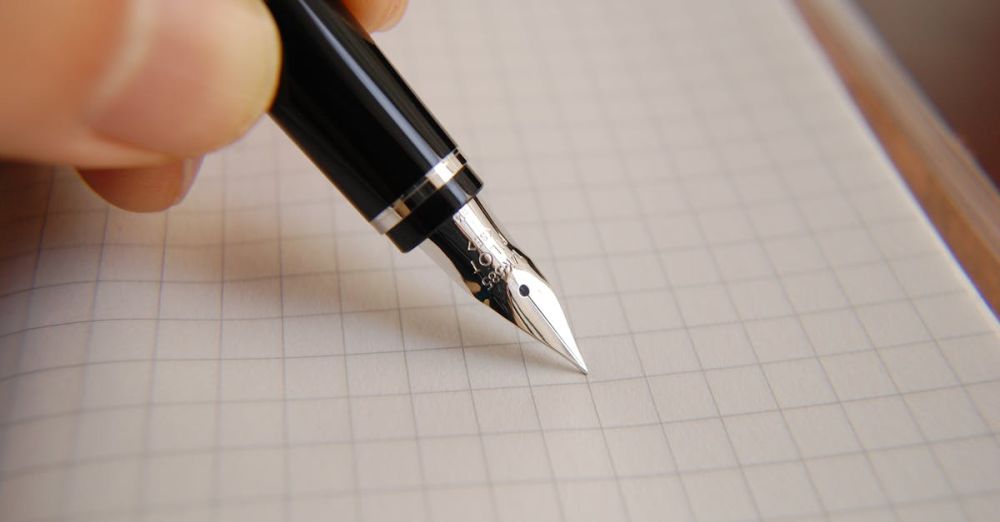 Tips - A detailed close-up of a fountain pen poised over graph paper, ideal for educational or business use.