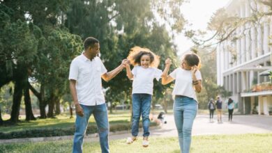 Families - Joyful family enjoying a playful day at the park, embracing love and togetherness under the summer sun.