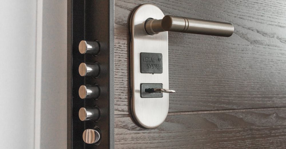 Safety - Metal door handle and lock system with key inserted, showcasing security features.