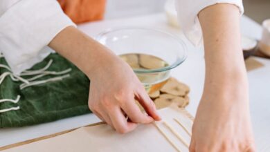 Craft Kits - A person crafting handmade candles with natural materials on a table.