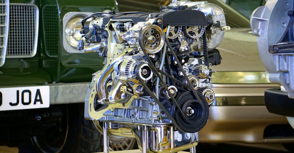 Gear - Detailed view of a polished car engine in an exhibition setting.