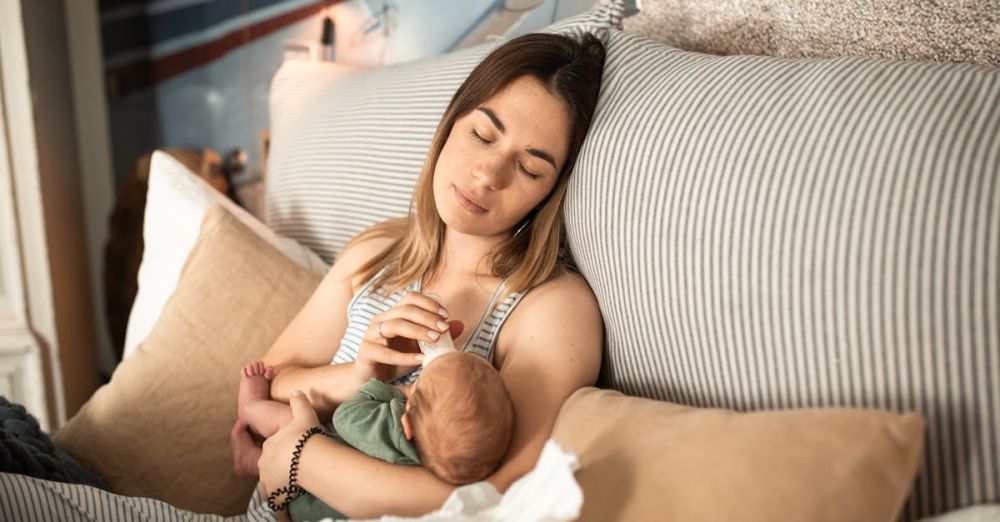 Baby Showers - Peaceful moment of a mother and newborn baby relaxing at home.