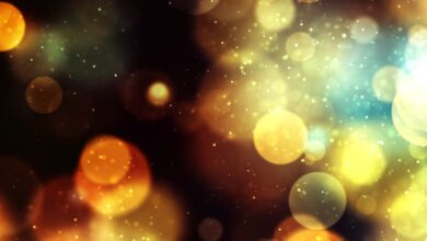 Lights - Vibrant bokeh background with golden and blue lights creates a magical and festive atmosphere.