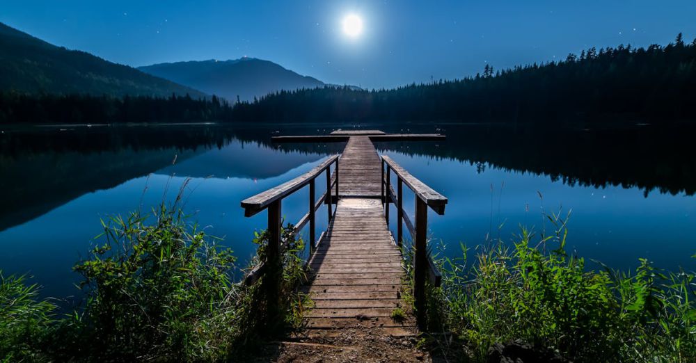 Whistler - Discover tranquility at a moonlit dock in Whistler, BC, under a starry sky.