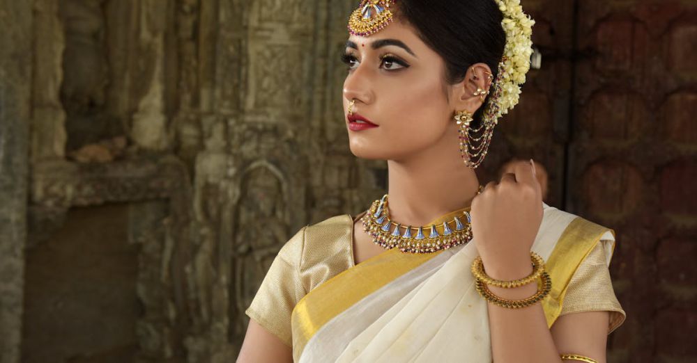 Traditional - Beautiful Indian woman in traditional saree, adorned with exquisite jewelry, set against historic architecture.