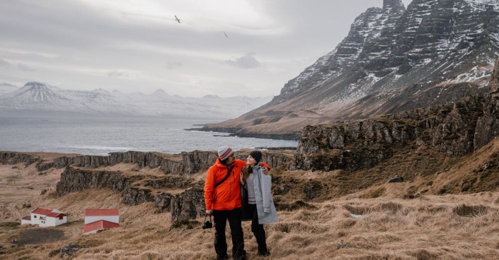 Hiking - A couple embraces in a dramatic Icelandic landscape, showcasing love and adventure.