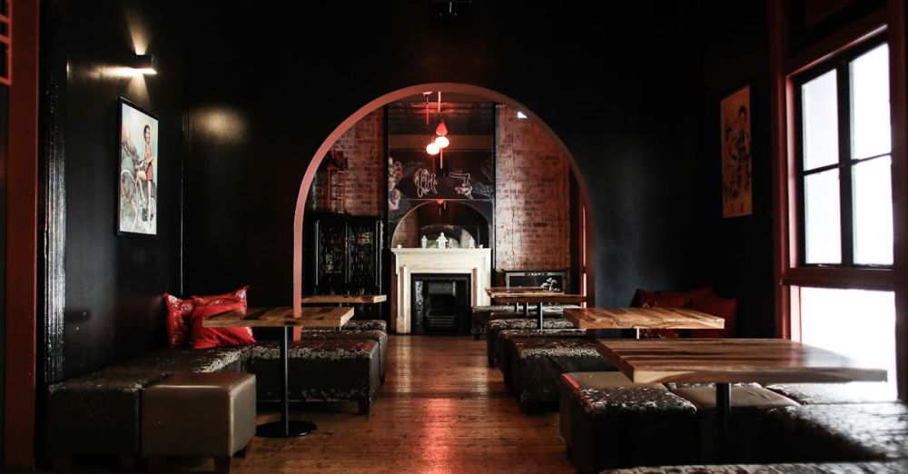 Fireplace - Explore the stylish, dimly-lit lounge bar with elegant seating and arched architecture for ultimate comfort.