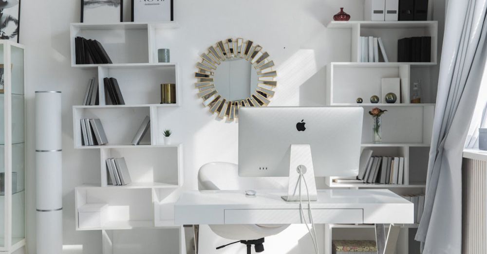 Desk Organizers - Bright minimalist home office setup with white shelves, desk, and iMac. Ideal for productivity.