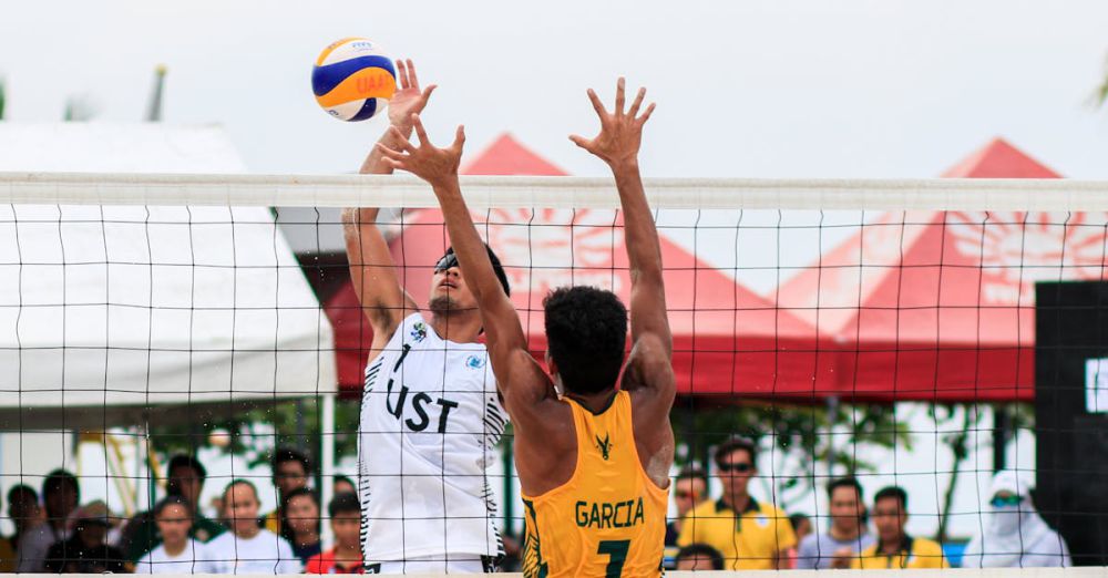 Volleyball - Beach volleyball action shot of two players competing at a tournament in Pasay, Philippines.