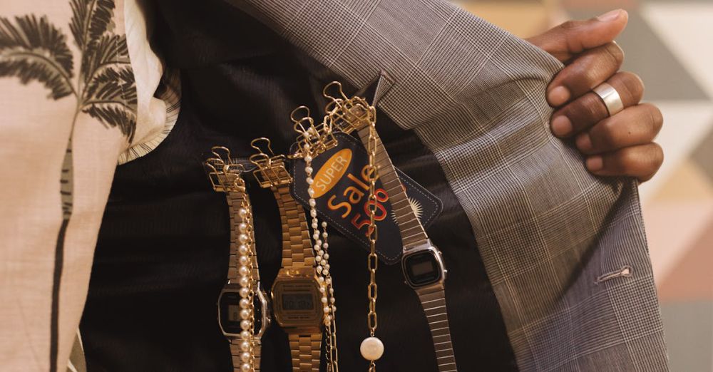 Luxury Watches - Close-up of man showcasing luxury watches inside suit jacket with sale tags.