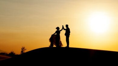 Sunset - Silhouetted couple dancing on the beach during a golden sunset, creating a romantic scene.