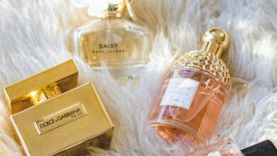 Perfumes - A collection of elegant perfume bottles arranged on a plush fur surface, showcasing luxury and sophistication.