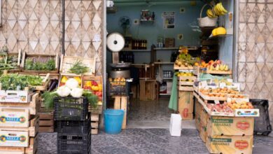 Marketplaces - A vibrant display of fruits and vegetables at a traditional market stand, showcasing fresh produce in crates.